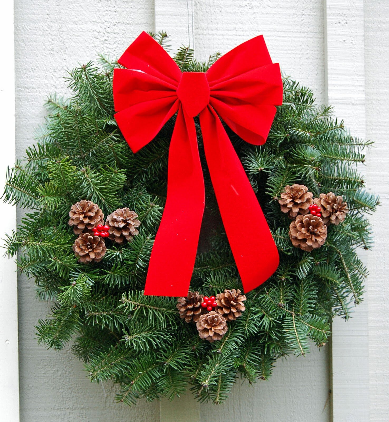 decoration-ideas-terrific-green-christmas-wreath-with-pine-cones-also-pretty-red-ribbon-wonderful-christmas-wreaths-ideas-with-creative-design