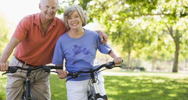 Older-Couple-Riding-Bikes-620x330